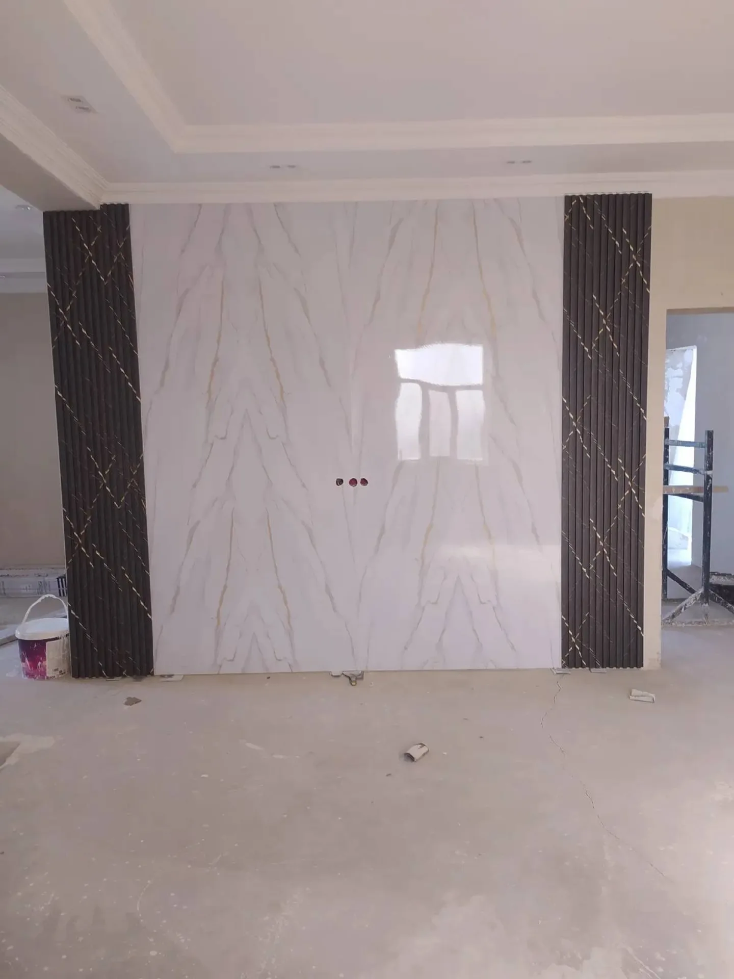 Final marble wall panel installation